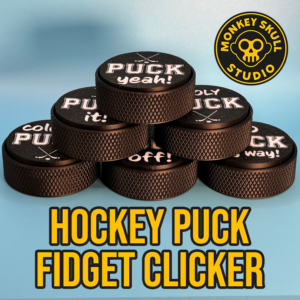 Black hockey puck fidget clicker with white text